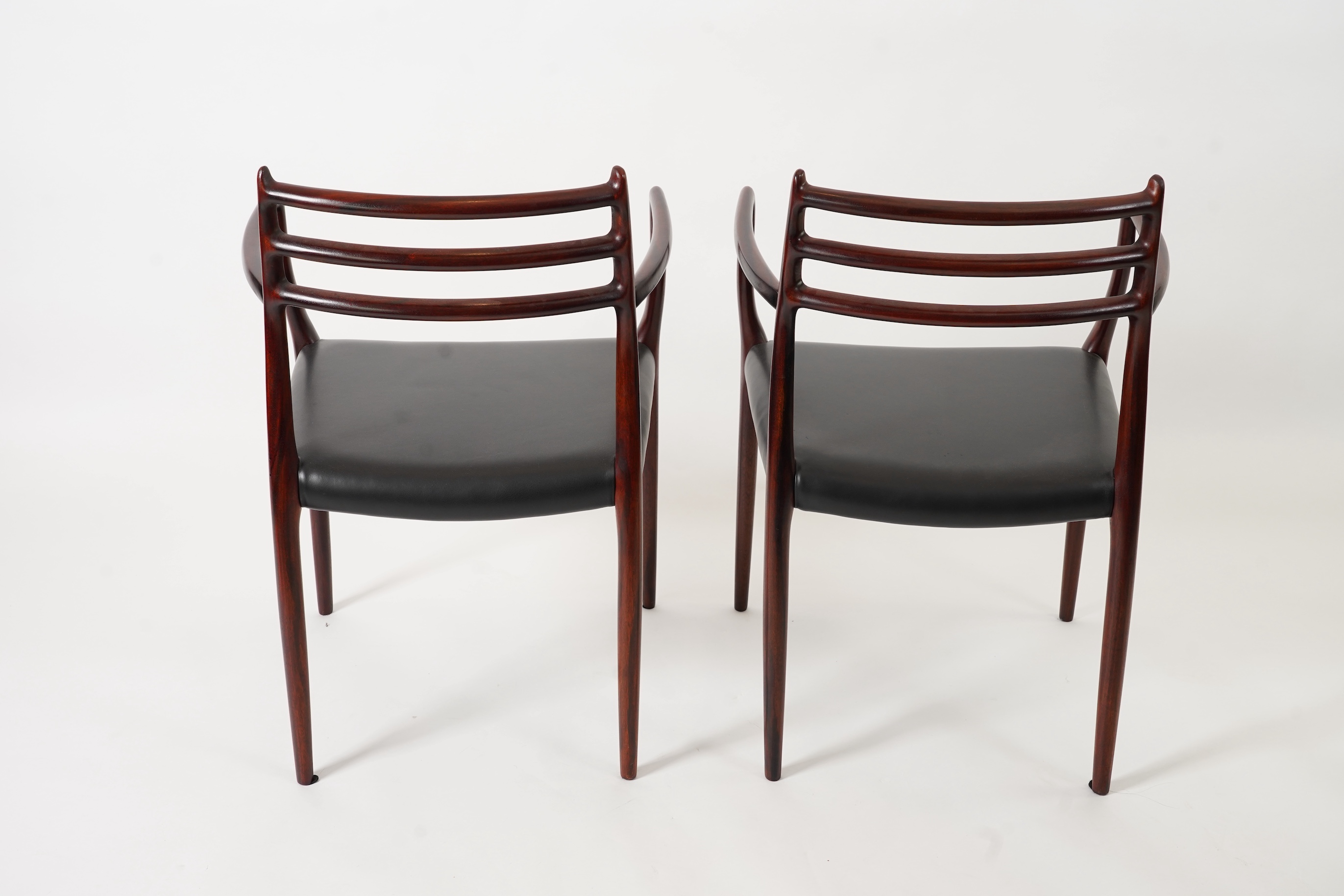 Niels Otto Møller (Danish, 1920-1982) for JL Møllers Møbelfabrik: A pair of 'Model 62' carver chairs